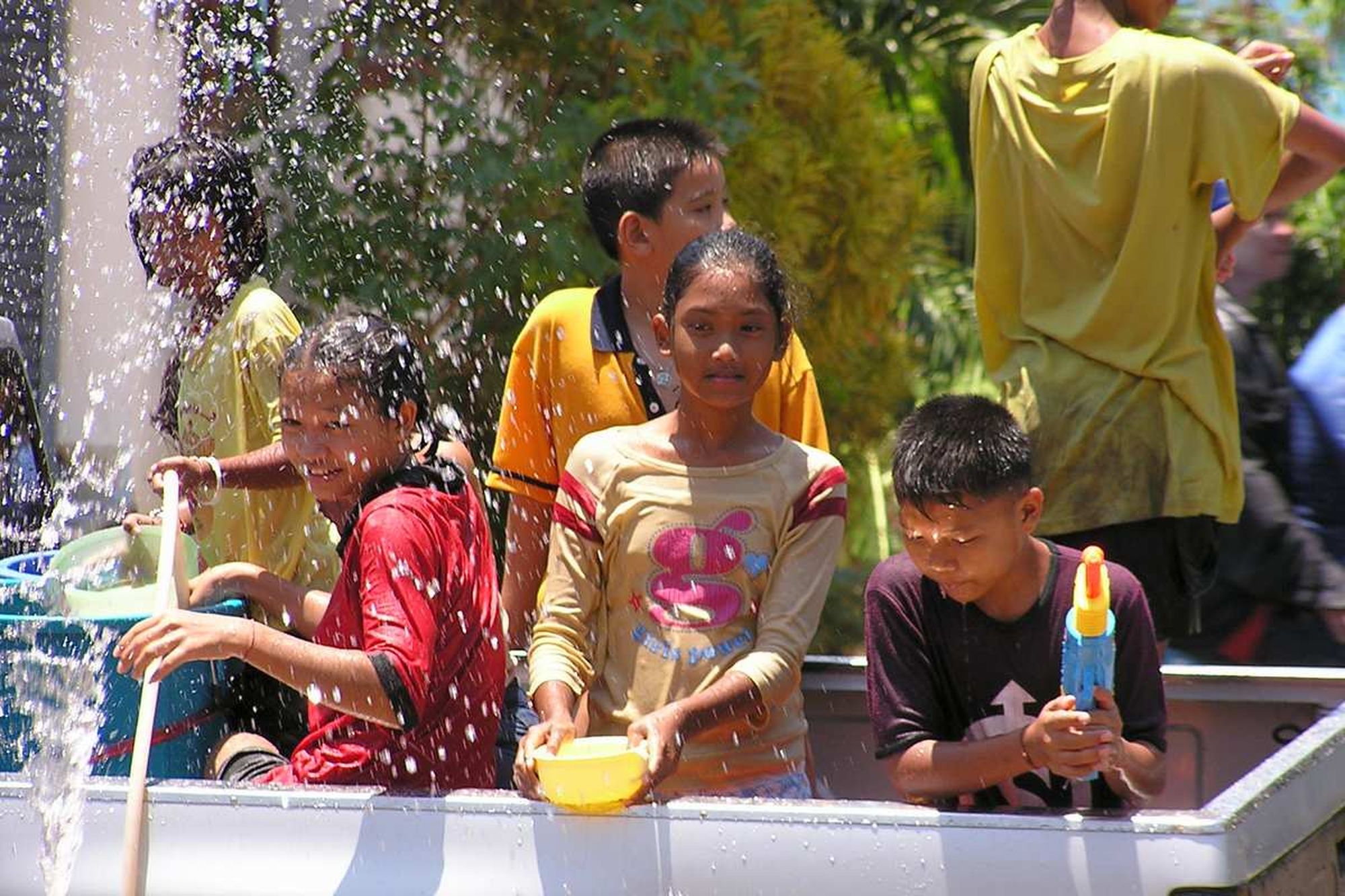 Kids having having with Songkran water.