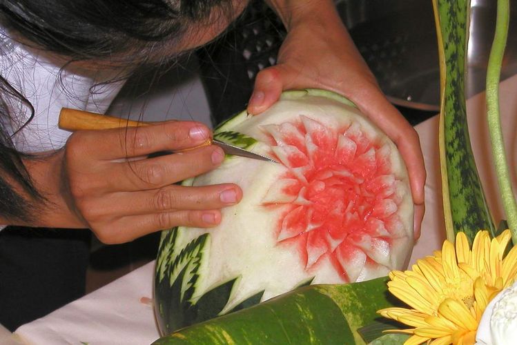 Lotus flower watermelon using precision knife.