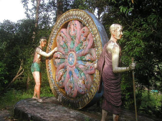 Monk statues rolling wheel of life 2.