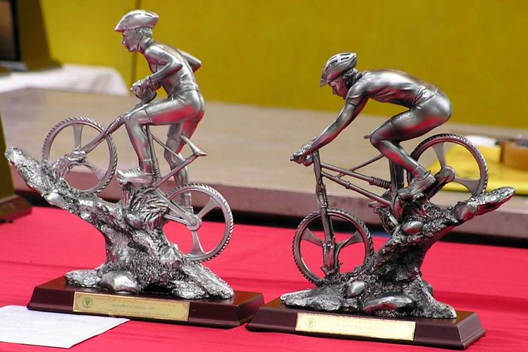 Two of the trophies are these casts of an uphill and a downhill MTB rider.